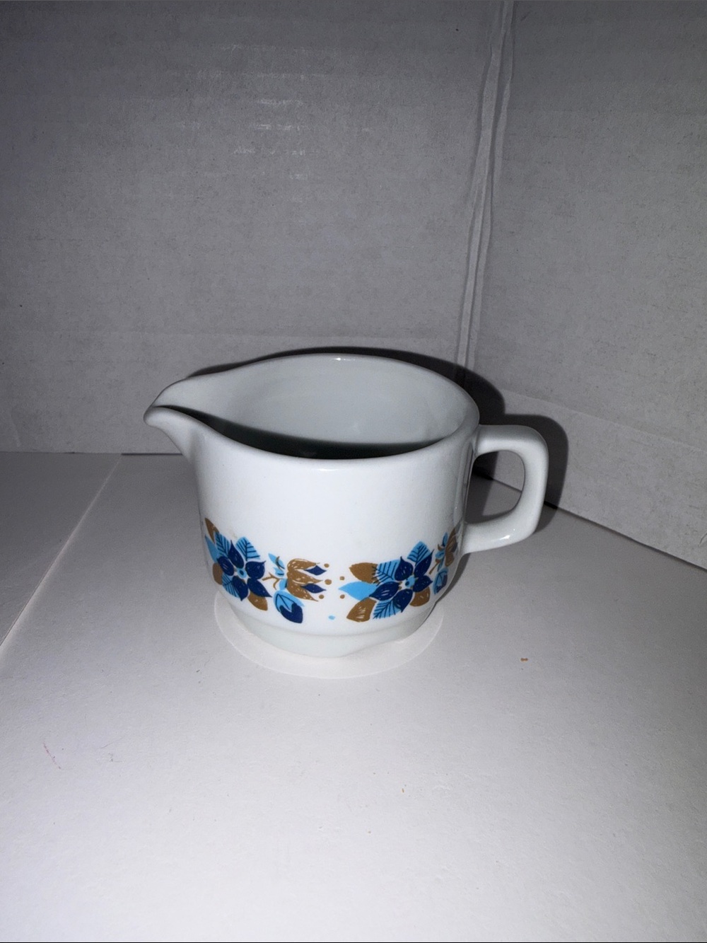 Vitro White Ceramic Creamer with Blue and Gold Floral Pattern